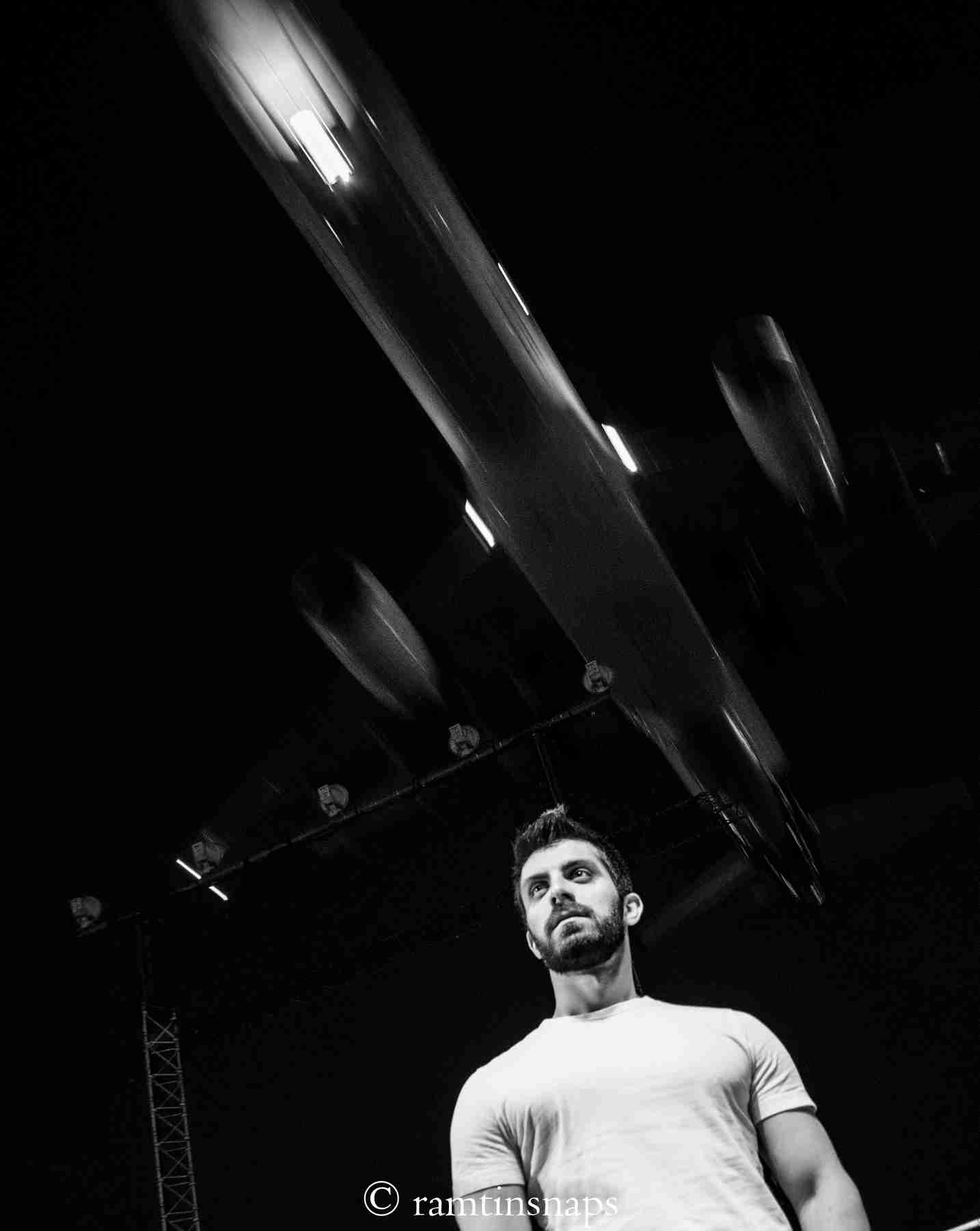 male model with a plane flying overhead